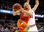 Syracuse guard Brandon Triche shoots past Indiana forward Cody Zeller during a Sweet 16 game on March 28. Triche claimed the Orange have mismatch advantages over Michigan at every position.