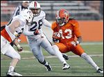  Bowling Green’s Travis Greene (13) looks to get past linebacker Coy Brown III (28)  during a scrimmage.