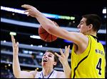  Michigan's Mitch McGary knocks the ball away from Florida's Erik Murphy. McGary has averaged 17.5 points and 11.5 rebounds per game for the Wolverines in the NCAA tournament.