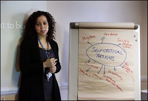 Psychological well-being practitioner Nabila El-Zanaty talks to a self-help psychological course class in London run by Britains publicly funded health system. 