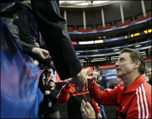 Louisville head coach Rick Pitino greets fans today after practice for their NCAA Final Four tournament college basketball semifinal game against Wichita State in Atlanta.