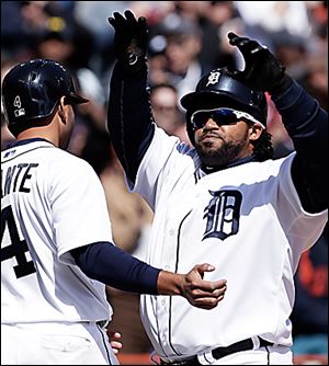  Prince Fielder, right, is congratulated by Omar Infante after hitting a three-run home run against New York Yankees.