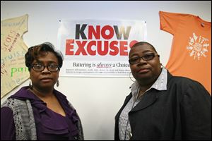 Lisa Lawrence, left, and Augustine Abbott work with Project Genesis, a domestic violence program of Family Service of Northwest Ohio. Ms. Abbott, supervisor of the program, says she has heard women repeat many reasons for staying in an abusive relationship. “The big one: ‘I love him,’ ” she says.