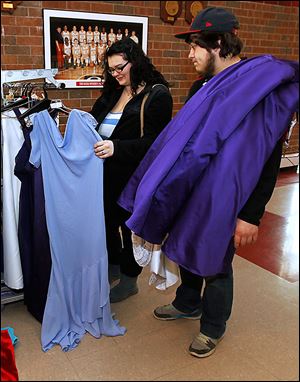 Senior Julia Williams of Flat Rock, Mich., gets an assist from her boyfriend, Kris Lewis of Holland. Mr. Lewis said he tells her if the dress doesn't look right on her.
