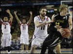  Wichita State's Fred Van Vleet tries to slip past Louisville's Tim Henderson on Saturday. Henderson, a former walk-on, has been playing since the injury to Kevin Ware.