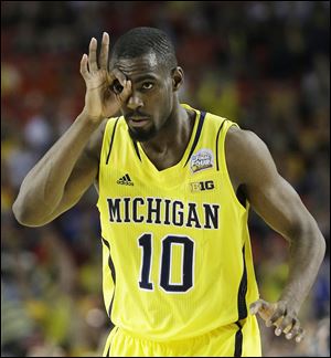 Tim Hardaway, Jr., and his Michigan teammates will eye a national championship when they play Louisville at 9:23 p.m. today in Atlanta.