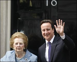 Britian's Prime Minister David Cameron poses with former Prime Minister Margaret Thatcher on the doorstep of 10 Downing Street  in London in June, 2010.