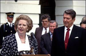Prime Minister Margaret Thatcher of the United Kingdom, left, makes remarks after visiting United States President Ronald Reagan, right, at the White House in Washington, D.C., on July 17, 1987.