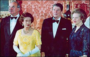 Margaret Thatcher, right, appears in 1984 with Queen Elizabeth II, West German Chancellor Helmut Kohl, left,and  President Ronald Reagan at London's Buckingham Palace for a dinner for summit leaders. 