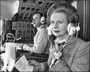 British Prime Minister Margaret Thatcher sits in the cockpit during a flight to Hong Kong from Beijing on Dec. 20, 1984.