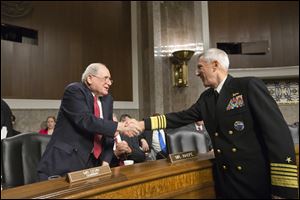 Senate Armed Services Committee Chairman Sen. Carl Levin, (D. Mich.), left, welcomes Adm. Samuel Locklear, commander of U.S. Pacific Command, on Capitol Hill in Washington prior to Locklear testifying before the committee's hearing focusing on the Korean peninsula.