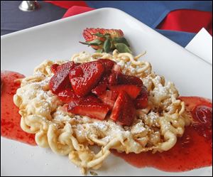 Fans can purchase a fresh strawberry funnel cake at Farr Out Funnels.