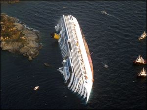 The luxury cruise ship Costa Concordia leans on its side after running aground off the tiny Tuscan island of Giglio, Italy, in January, 2012.
