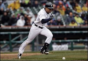 Detroit Tigers' Omar Infante runs past his bunted ball for a single against the Toronto Blue Jays in the fifth inning.