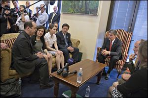 Sen. Joe Manchin, D-W.Va., seated right, meets in his office with families of victims of the  Sandy Hook Elementary School shooting in Newtown, Conn., on the day he announced that they have reached reached a bipartisan deal on expanding background checks to more gun buyers, on Capitol Hill in Washington, Wednesday. Seated on sofa from left are David and Francine Wheeler, who lost their 6-year-old son Ben in the shooting, Katy Sherlach and her father Bill Sherlach, whose wife Mary Sherlach was killed. At far right is Mark Barden, father of victim Daniel Barden. 