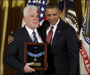 Ray Kapaun accepts the Medal of Honor given posthumously to his uncle, U.S. Army Chaplain Emil Kapaun, by President Obama in Washington last week.