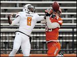  Jared Cohen, right, of the Orange, makes a catch against  Cameron Truss of the White in BGSU's spring game.