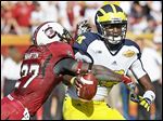 Michigan is tailoring its offense this season to help quarterback Devin Gardner more. The Wolverines are leaning toward a more pro-style offense rather than a spread.