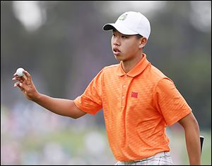 Amateur Guan Tianlang of China is the youngest player in Masters history to make the cut. He advanced despite a one-stroke penalty.