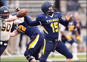 Toledo's Blue team quarterback Logan Woodside throws a pass during the spring game at the Glass Bowl on Friday.  The Gold team beat the Blue team 21-10. 