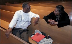The Rev. Nathaniel Adams Jr. of Euclid talks with the Rev. Christine Thompson of Cleveland between sessions during the conference.
