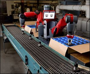 In an undated handout photo, the Baxter robot from Rethink Robotics. Newer, gentler factory robots no longer have to be fenced in to protect workers from accidents. 