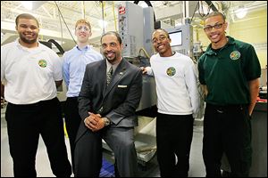 Romules Durant, incoming Toledo Public Schools superintendent, meets with seniors,  from left, Josh  Dunn, Sean Danielak, Darryl Bebley, and Malik Strong at Toledo Technology Academy.  