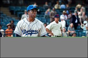 This film image released by Warner Bros. Pictures shows Chadwick Boseman as Jackie Robinson in a scene from '42.'