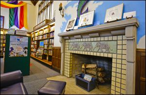 This fireplace in the children’s area of the branch is one of two in the 83-year-old building. Library officials want to add more spaces for patrons to plug in laptops as well as open, reading areas.