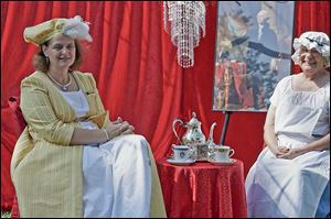 Rebecca Roper, left, and Judy French Lowell re-enact a tea of 19th century Frenchtown at the River Raisin National Battlefield Park in Monroe. A period tea will be held at the park on Saturday.