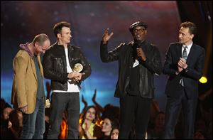 Joss Whedon, Chris Evans, Samuel L. Jackson and Tom Hiddleston, from left, accept the award for best fight for 