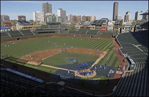 Two people with knowledge of the negotiations between the Ricketts family that owns the Cubs and the city say the two are near an agreement on a $500 million project at Wrigley Field.