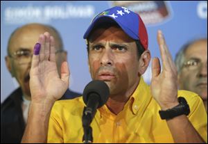 Opposition presidential candidate Henrique Capriles talks to journalist after official results of the presidential elections were announced. Capriles is refusing to accept the results of Sunday's presidential election and is demanding a recount.