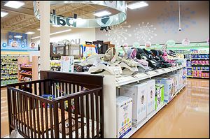 Kroger's new store in Holland, to be built in 2014, will have a wider array of products, including cribs and car seats in its Baby World section.