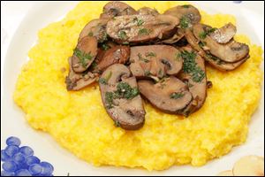 Polenta topped with sauteed mushrooms.