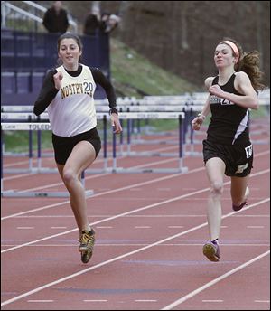 Northview's Janelle Noe, left, and Perrysburg's Courtney Clody race in the 1600-meter run Saturday at the Unitversity of Toledo high school invitational. Noe placed third in the 300-meter hurdles last year at the Division I state meet.