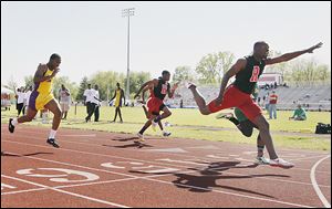 Rogers senior Michael Lipkins stretches out to win the 100-meter dash at the City League meet last year. He also won the 200.