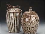  Two jars are part of potter Julie A. Beutler's Sticks and Stones series that feature unusual handles.