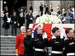  Margaret Thatcher’s family, from left, daughter Carol Thatcher and partner Marco Grass, Sarah Thatcher, wife of son Mark Thatcher, and grandchildren Michael and Amanda Thatcher watch as the coffin is carried away after Wednesday’s funeral.