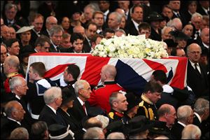 The coffin containing the body of former British Prime Minister Margaret Thatcher leaves the ceremonial funeral at St Paul's Cathedral in London, today.