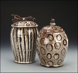 Two jars are part of potter Julie A. Beutler's Sticks and Stones series that feature unusual handles.