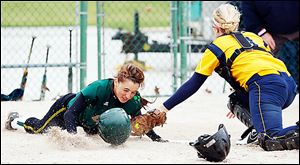 Clay's Lindsay Schiavone scores against Notre Dame catcher Cory Brickman in the fourth inning.