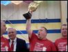  Shawn Zaborski hoists the trophy as winner of the 2013 Polish-American Community of Toledo’s Kielbasa Cook-off, making his team, Polish Village Kielbasa, the 'Kielbasa King' for the year. Celebrating with him are, from left, Ladden Vernon; Stan Machosky, president of the PACT board of directors, and Eric Smigelski. 