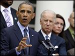  President Barack Obama, next to Vice President Joe Biden, gestures as he speaks during a news conference Wednesday in the Rose Garden of the White House.