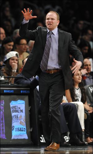 Detroit Pistons Head Coach Lawrence Frank directs his team crosscourt against the Brooklyn Nets in the first half of an NBA basketball game on Wednesday, April 17, 2013,at Barclays Center in New York. Frank was summarily fired today.