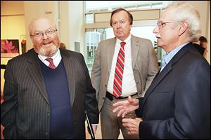U.S. presidential historian Richard Norton Smith, left, talks with Clyde Scoles and Tom Culbertson during the Authors! Authors! event at the Main Library.