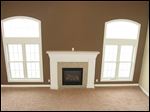  The great room’s large windows flood the room with sunlight.