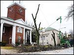  In January, crews with the Toledo Division of Parks and Forestry cut limbs from a tree along Collingwood Boulevard, north of Ban-croft Street, outside the GHDT Worship Center.