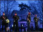  Gunfire erupted tonight amid the manhunt for the surviving suspect in the Boston Marathon bombing, and police in armored vehicles and tactical gear rushed into the Watertown neighborhood.