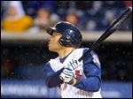  Toledo Mud Hens player John Lindsey hits an RBI triple in the fourth inning Friday against the Columbus Clippers in the second game at Fifth Third Field.